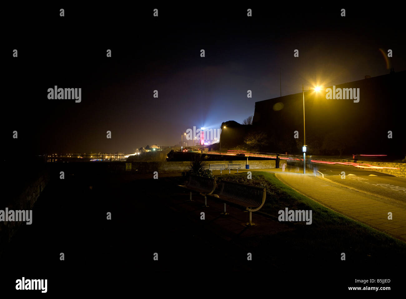 lighthouse. smeatons tower plymouth hoe with beam of light emitting ...