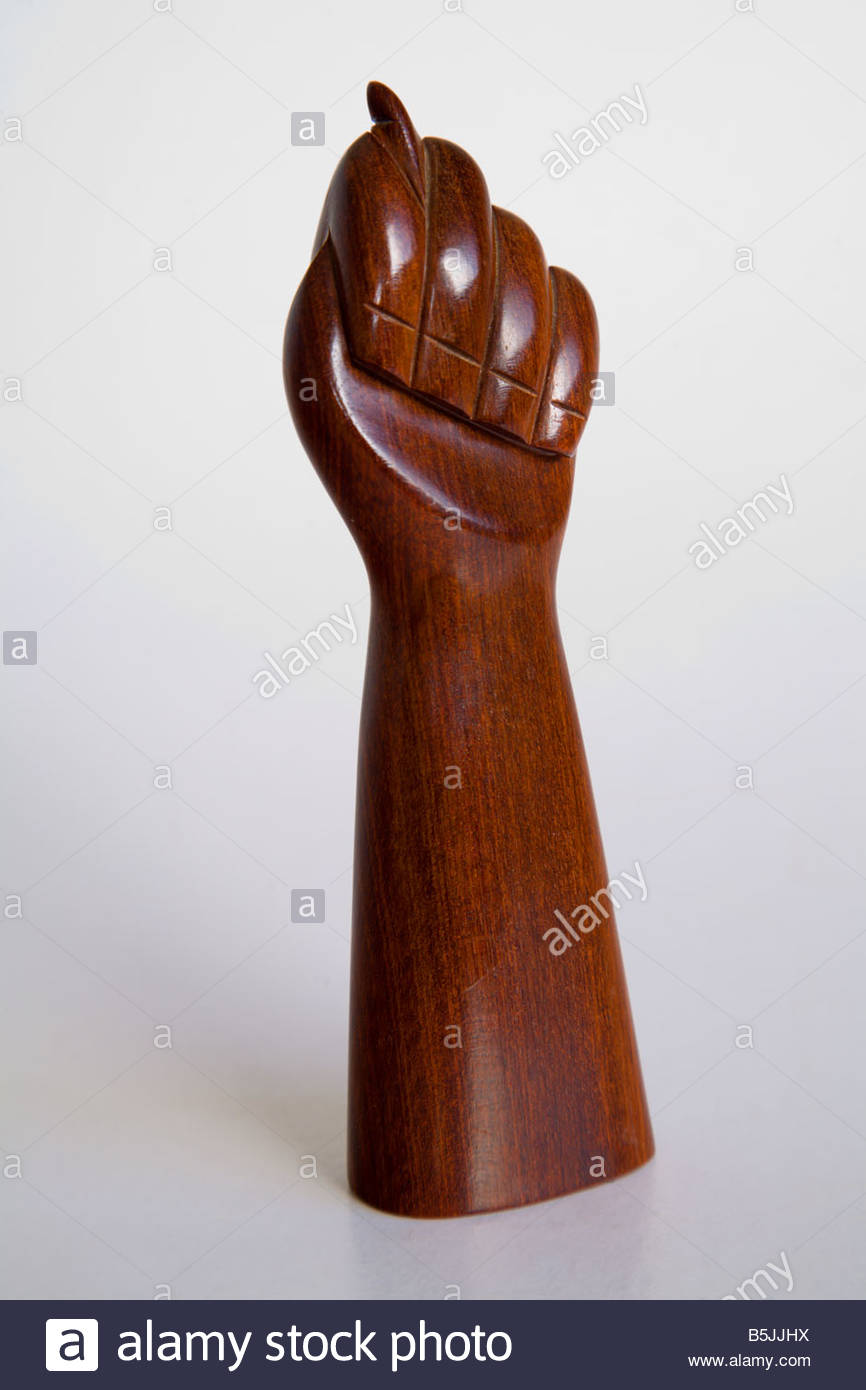 Brazilian Figa wooden good luck charm on white background with copy