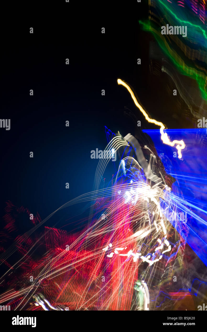 Colourful abstract light and lights fairground tails at night Stock