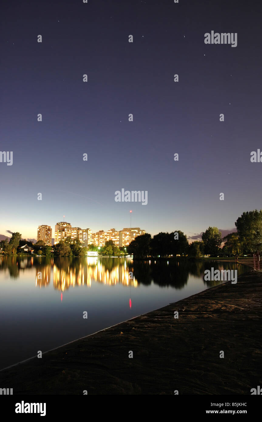 Brightly lit residential apartment buildings at Mooneys Bay waterfront