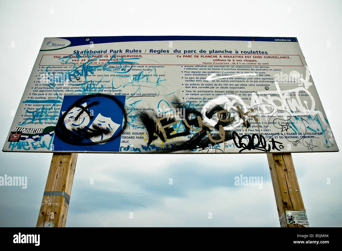 Graffitied skate park rule board. Stock Photo