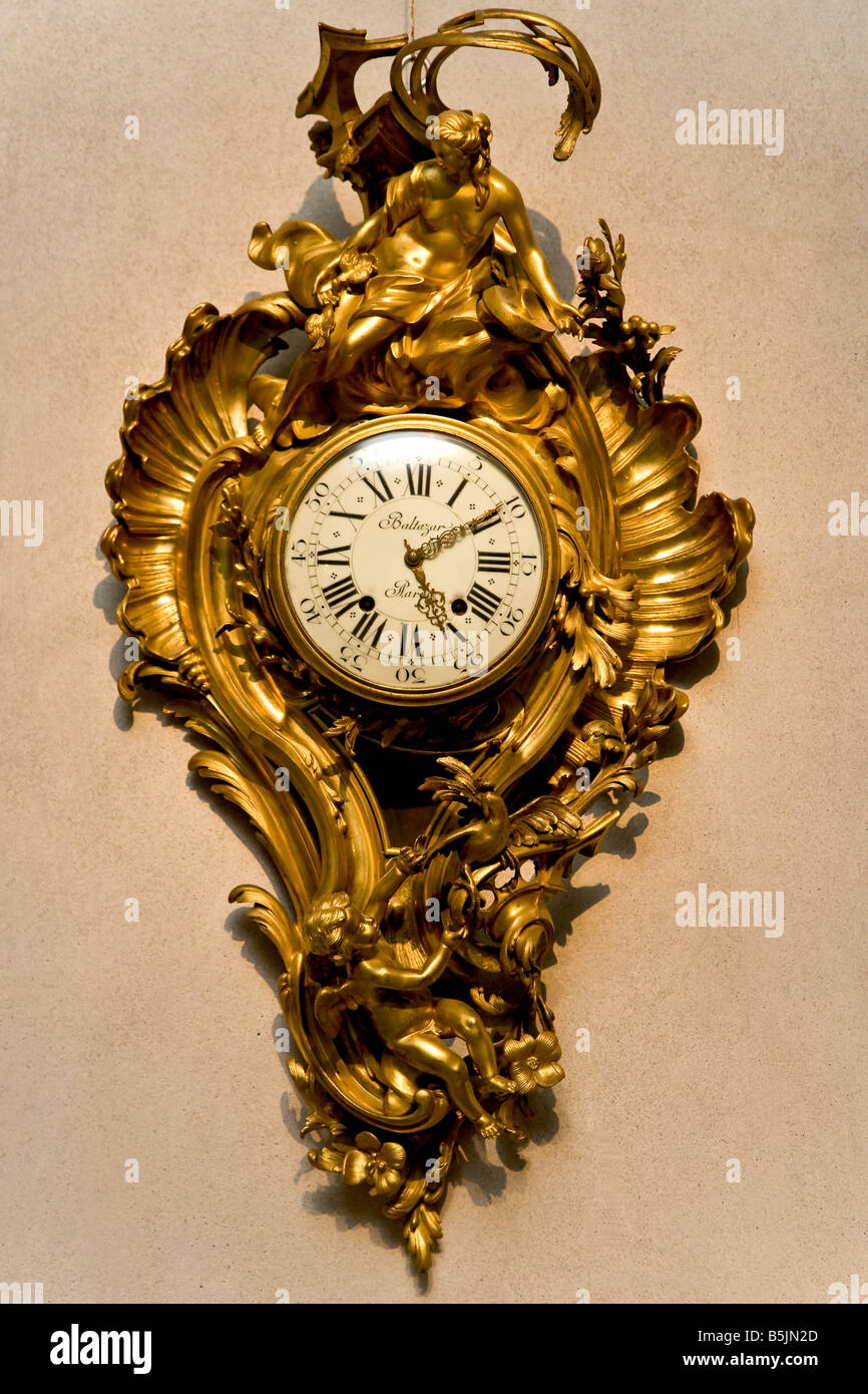 Old gilded wall clock hi-res stock photography and images - Alamy