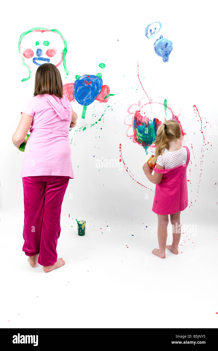 Pretty Little Girl  art student, painting with paint splashes, graphic smears, daubs and smudges. Stock Photo