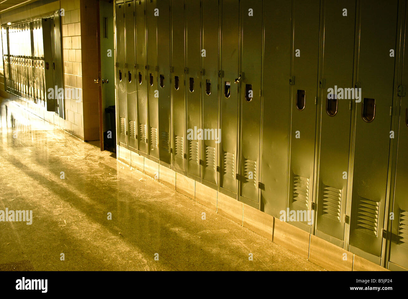 Rows of lockers in a school hallway. Stock Photo