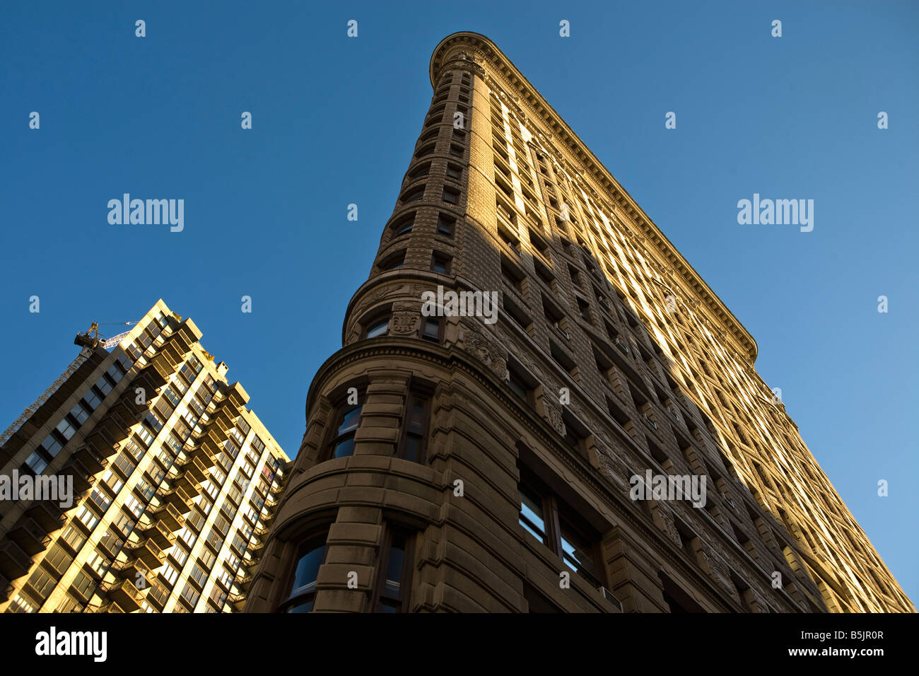 The Flatiron Building on  the triangle of Fifth Avenue, Broadway and  23rd Street in New York City USA Stock Photo