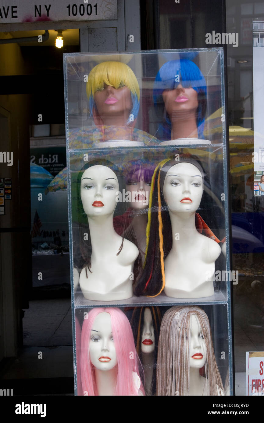 Colorful wigs on display in a store window in New York City Stock Photo -  Alamy