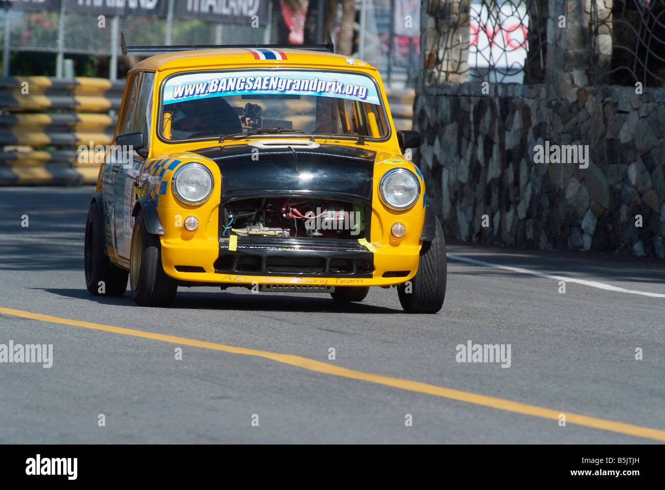 Yellow and black Mini racing at the city circuit of Bang Saen Speed Festival in Thailand 2008 Stock Photo