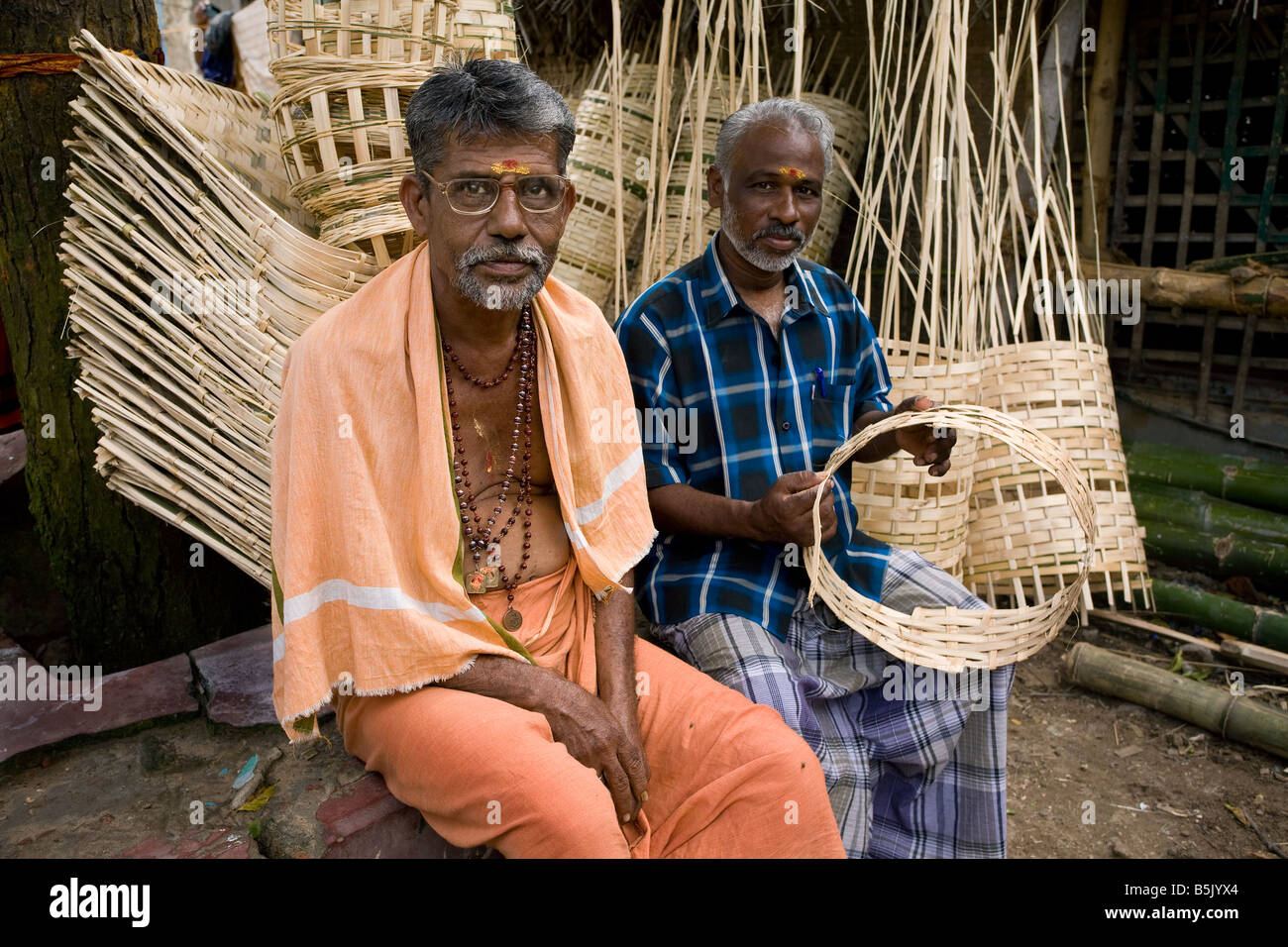 Tsunami survivor Mr Rajindra Head of Velipalayam Elders self-help group organises bamboo weaving for the community income Stock Photo