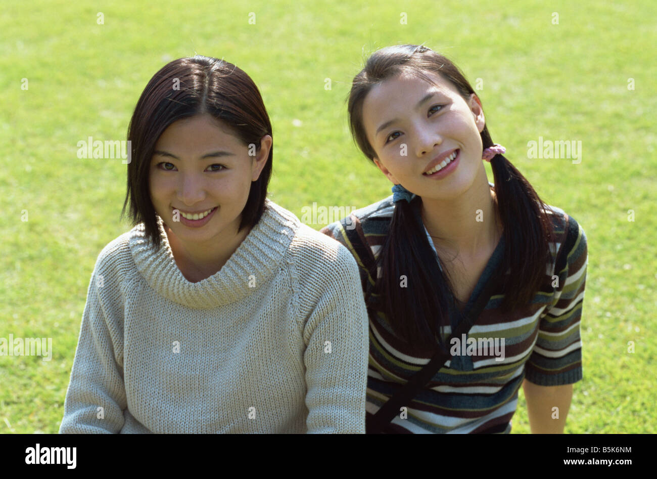 A portrait of two young Asian women Stock Photo - Alamy