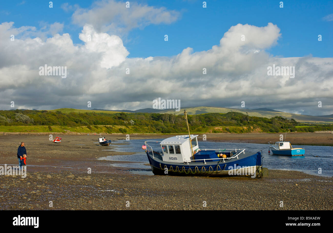Boats on the beach at low tide, Ravenglass, West Cumbria, England UK Stock Photo