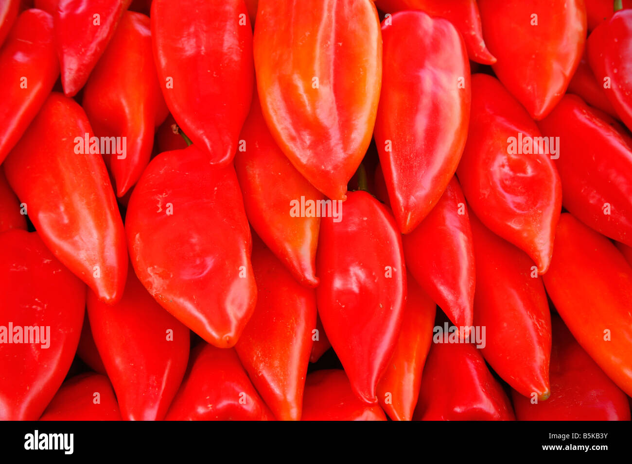Display of red coloured peppers in market in Europe Stock Photo