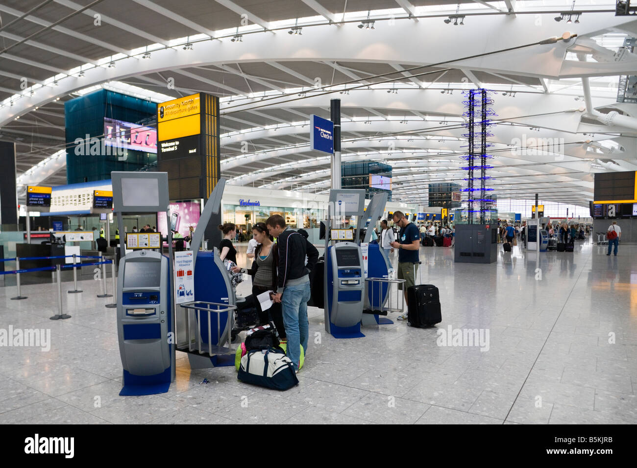 self check in, departure level, Terminal 5, Heathrow, London, England Stock Photo