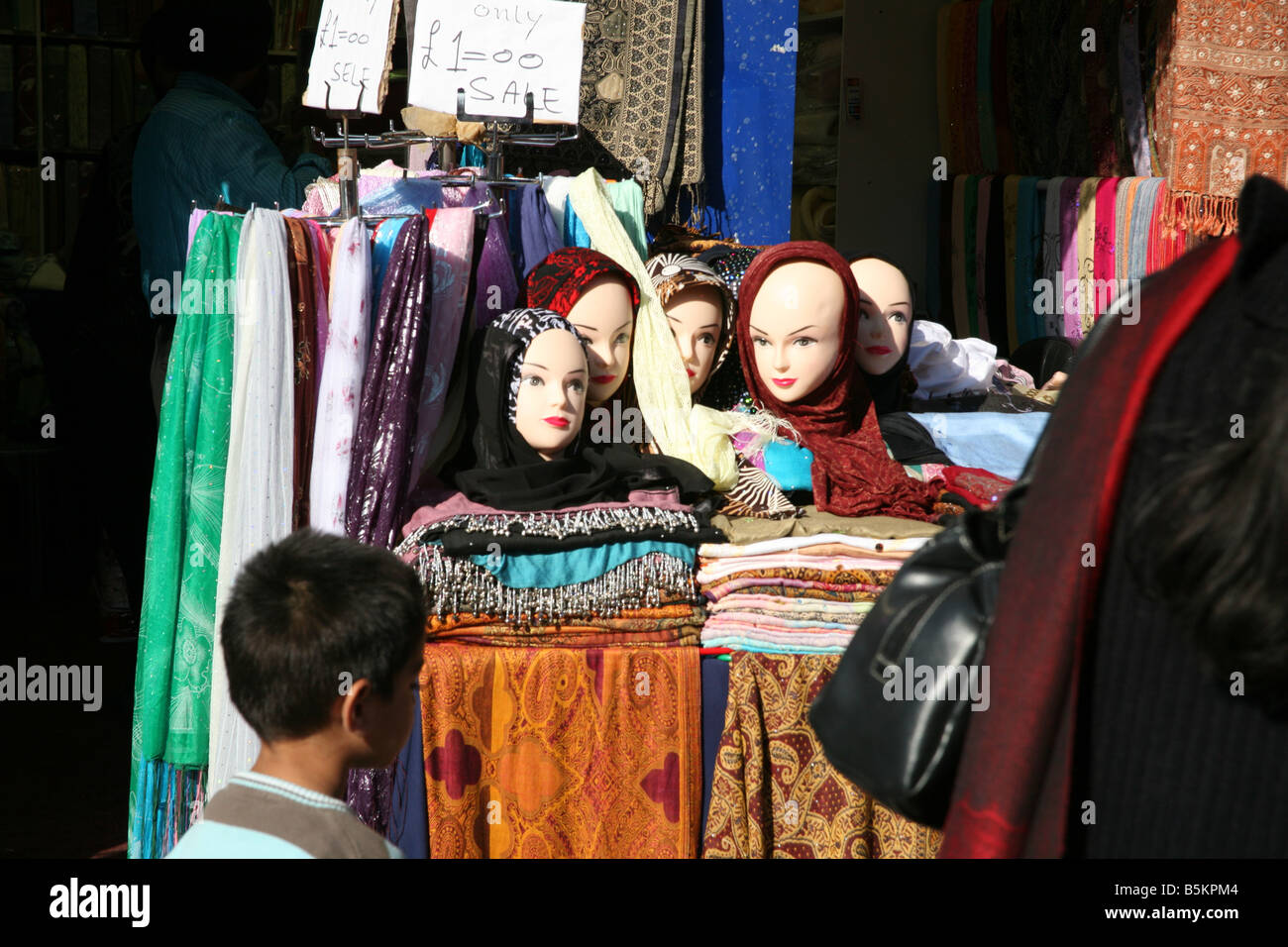 Headscarves for women on sale in shop in Southall Broadway London Stock Photo