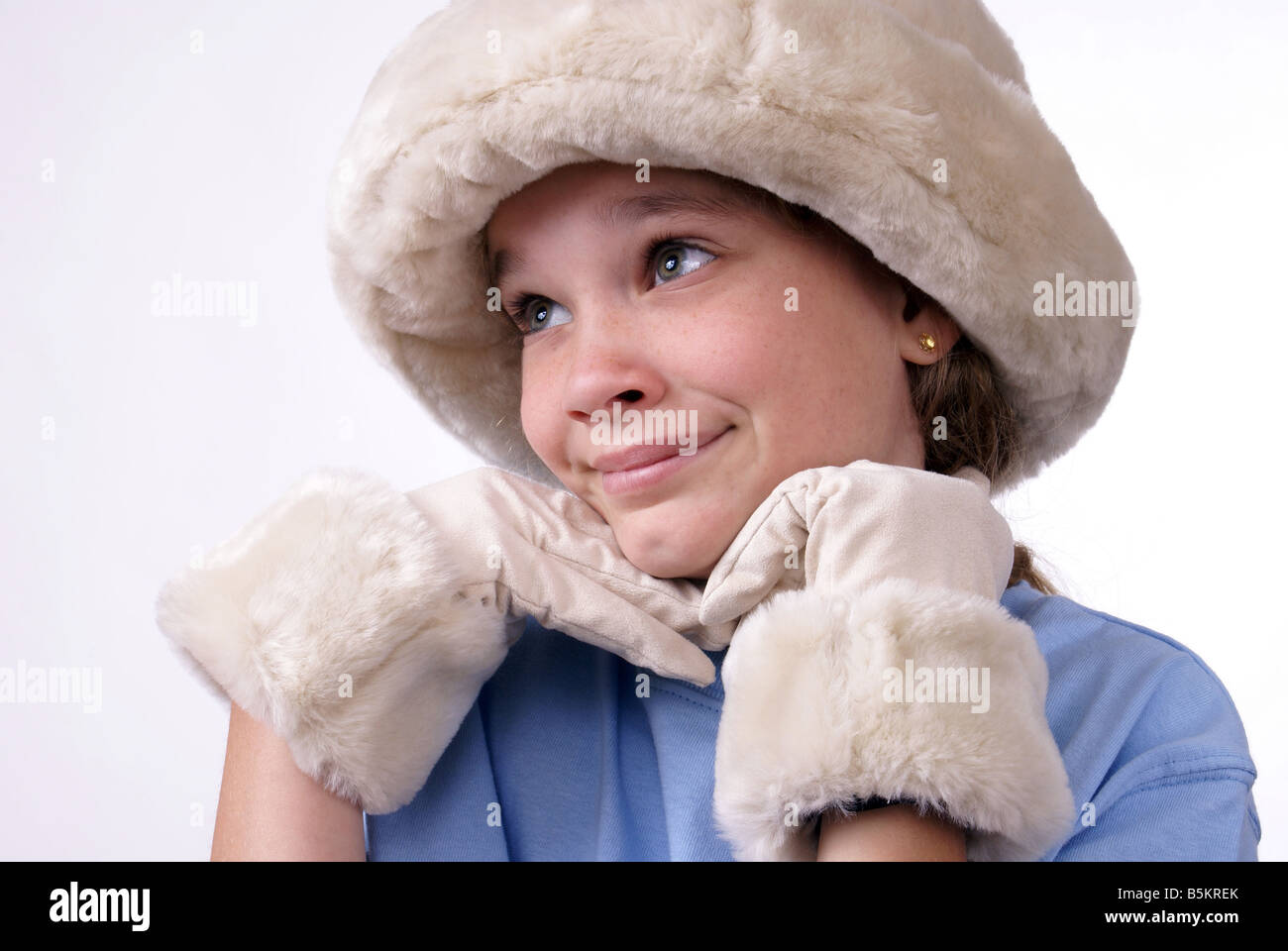 Girl Wearing Grownup Hat and Gloves Stock Photo
