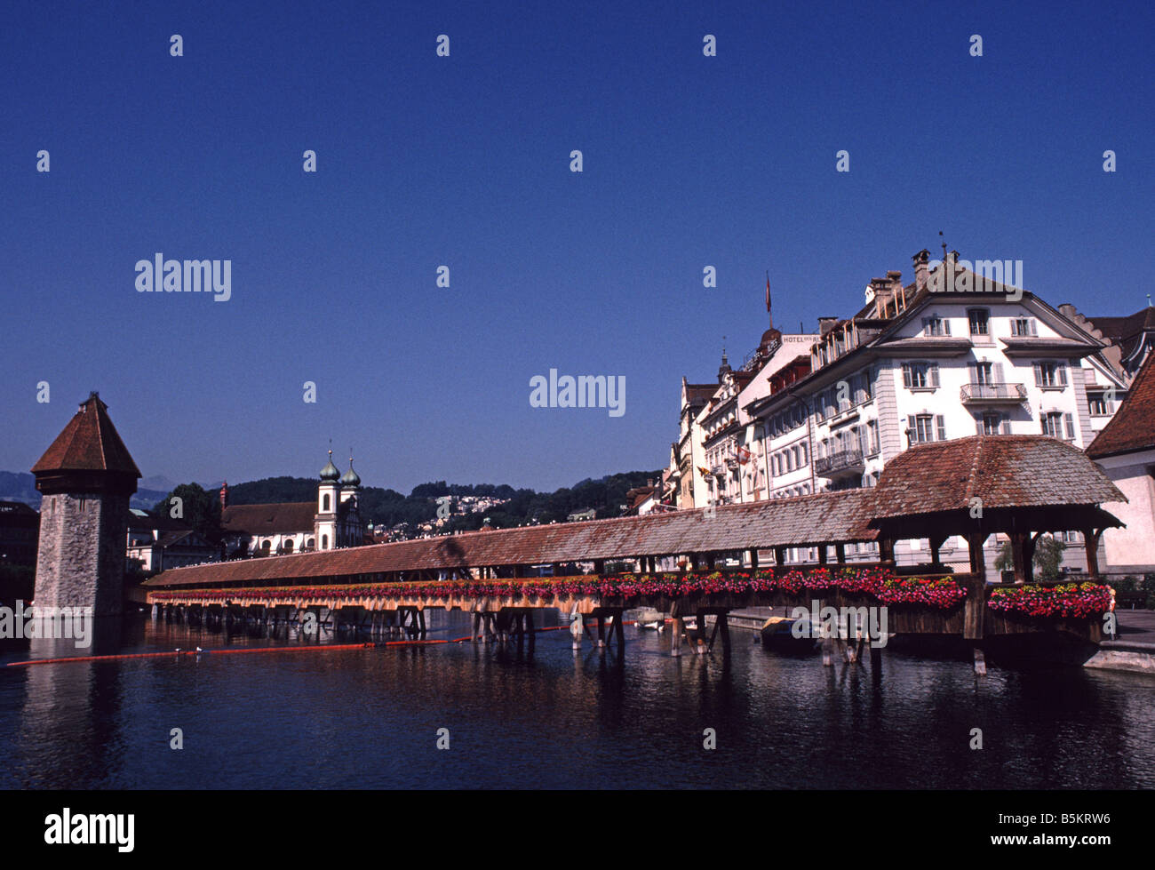Chapel Bridge covered wooden bridge and Water Tower in Lucerne Switzerland Stock Photo