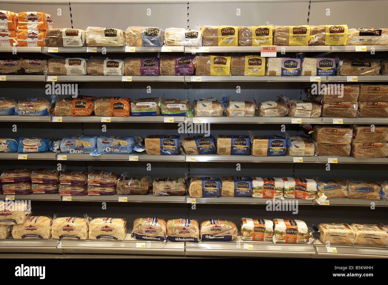 Bread stacked on supermarket shelves Supermarket interior Stock Photo