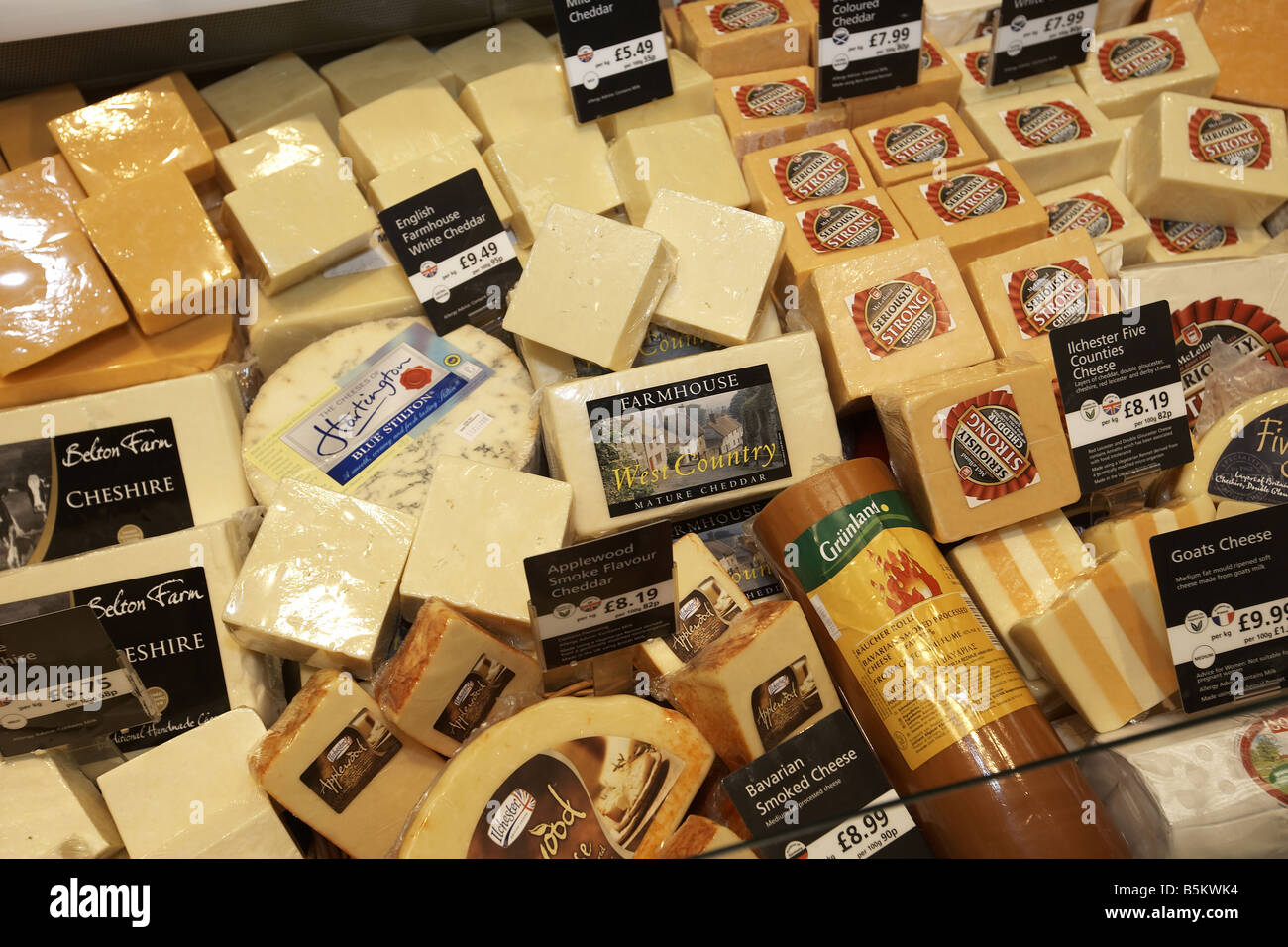Cheese on display in supermarket Stock Photo Alamy
