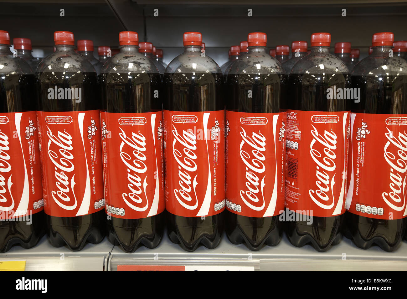 Soft drinks on display in supermarket interior Coco Cola Stock Photo