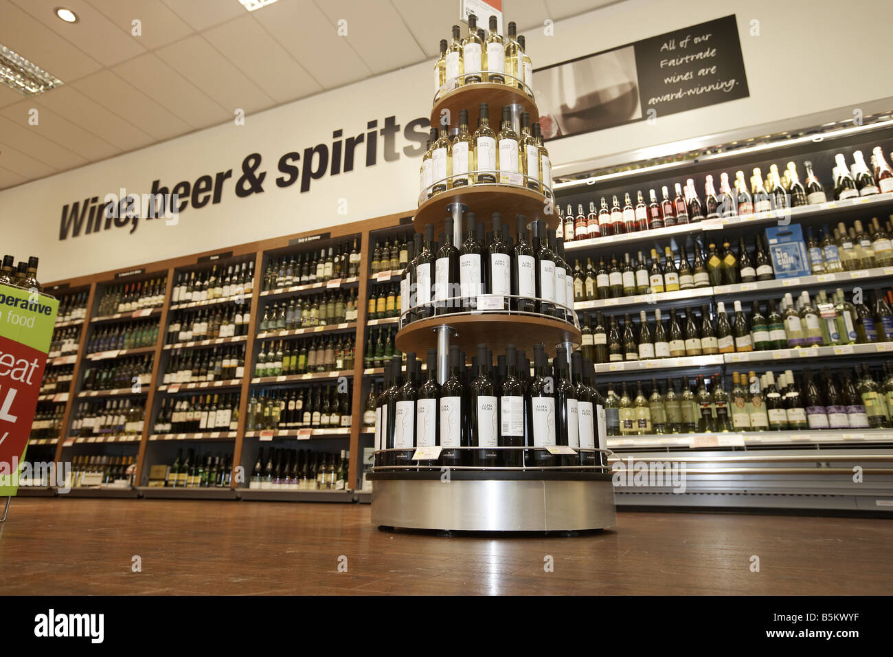 Wine beer and spirits on display in supermarket interior Stock Photo