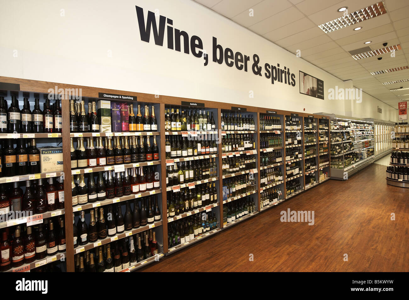 Wine beer and spirits on display in supermarket interior Stock Photo