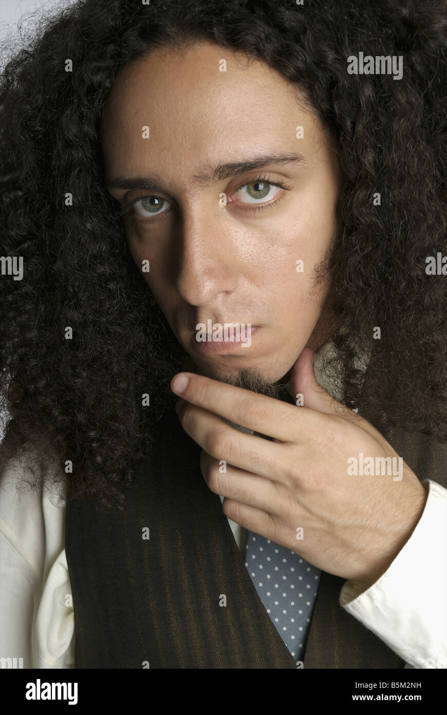 Shaggy haired man in formal attire. Stock Photo