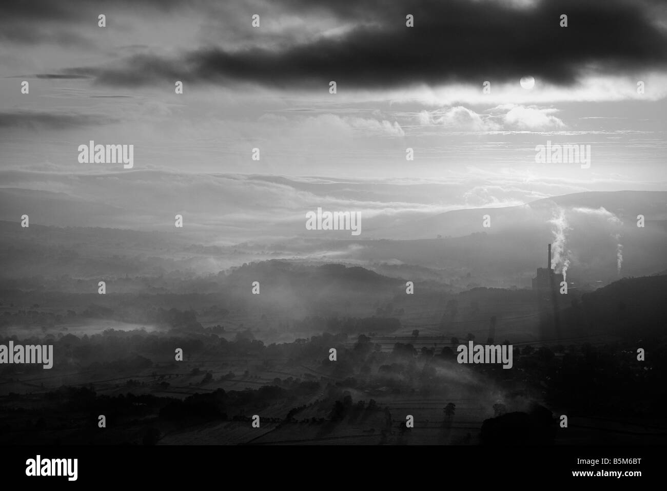 castleton valley and cement works from mam tor in black and white with