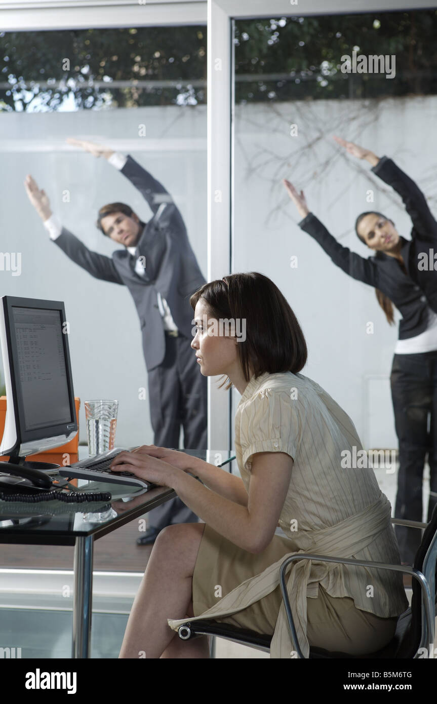 Business people practicing yoga Stock Photo - Alamy