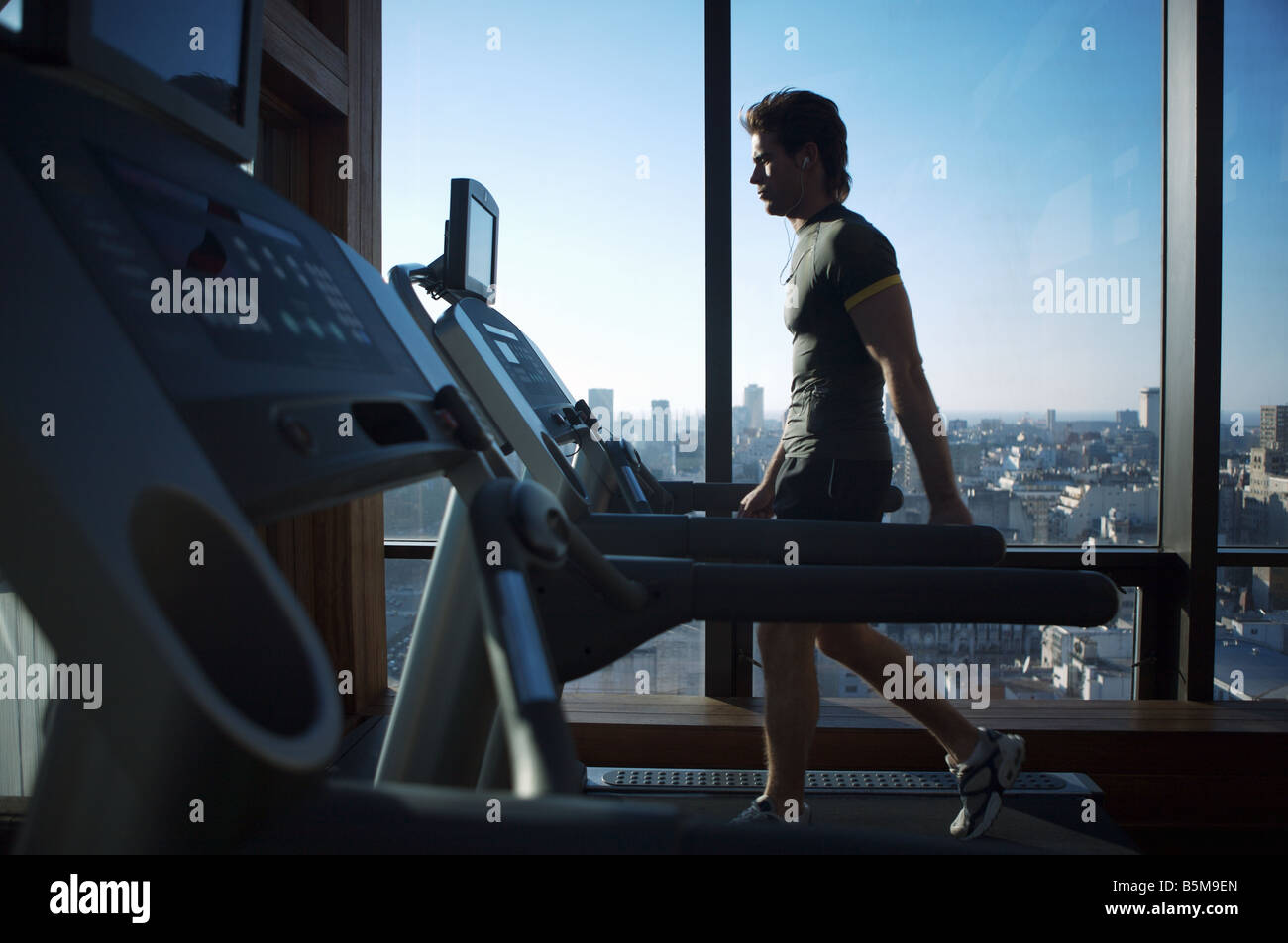 Man exercising on a treadmill. Stock Photo