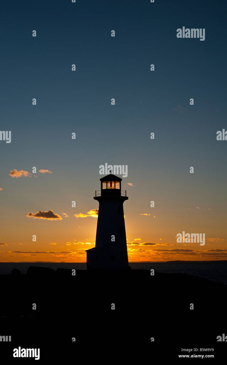 The lighthouse at Peggy s Cove Nova Scotia Canada with sedimentary rocks at sunset on St Margarets Bay st margarets bay Stock Photo