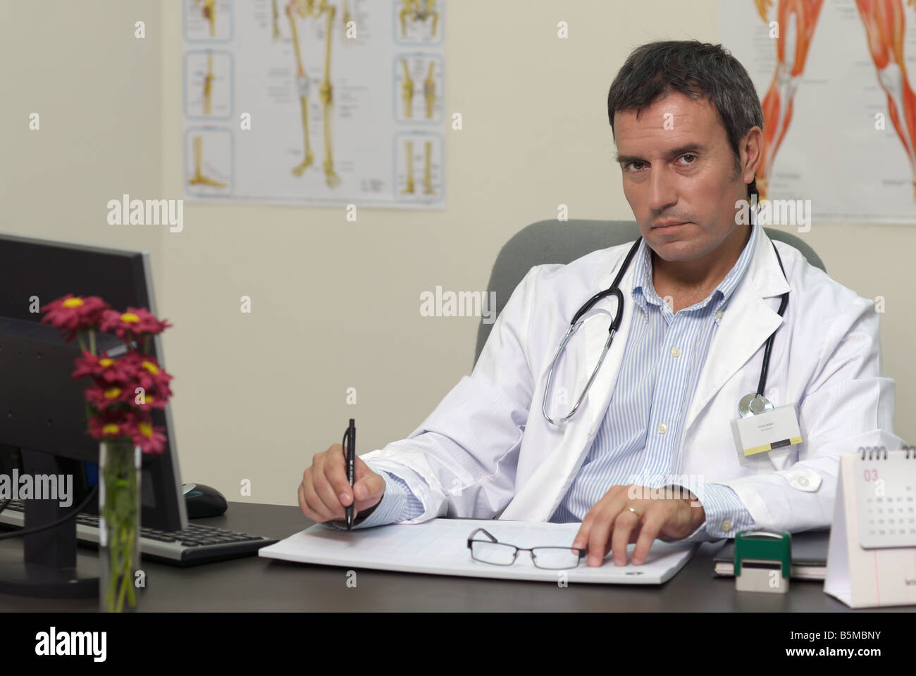 Doctor attending at office Stock Photo