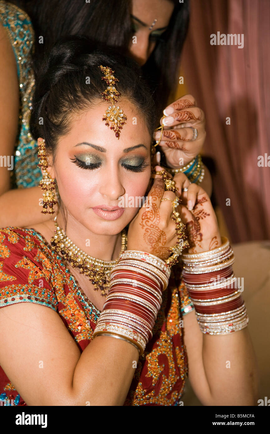 beautiful sikh bride getting ready on her day of the ceremony with all her bangles and traditional dress, Sikh bride, Traditional Sikh bride, dress, Stock Photo