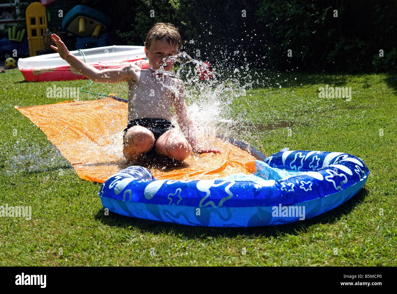 Boy In Paddling Pool Stock Photo - Alamy