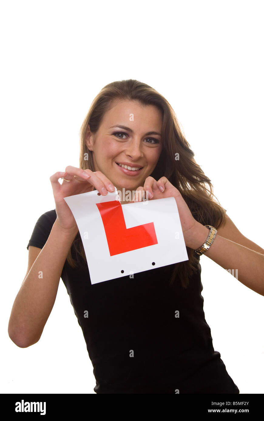 woman tearing up L plates Stock Photo