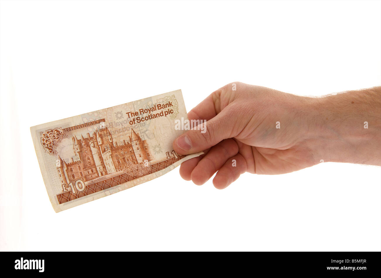 male mans male right outstretched hand holding a royal bank of scotland ten pound note against a white background Stock Photo