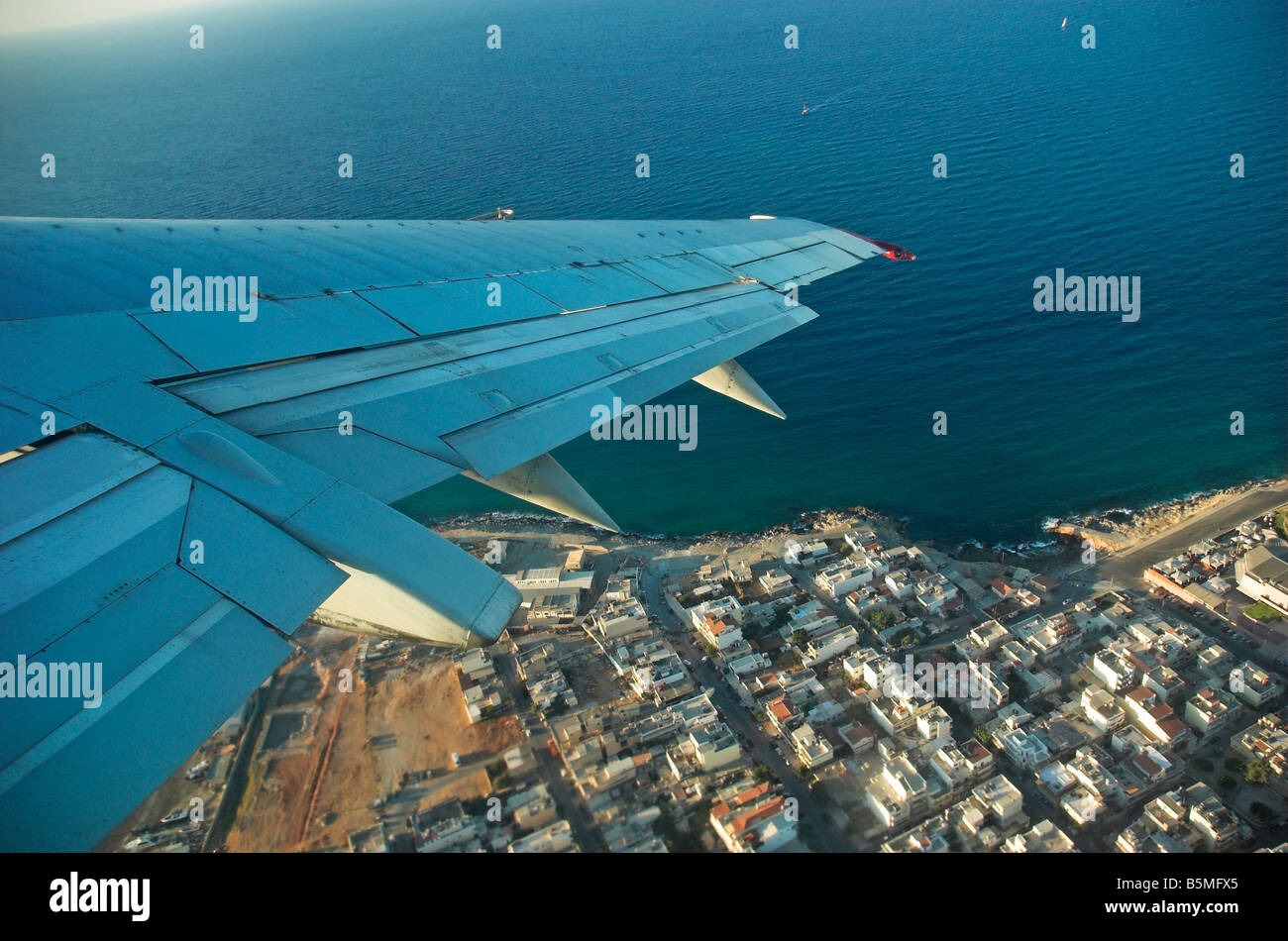 Wing of aircraft in flight over Heraklion Crete island Greece Stock
