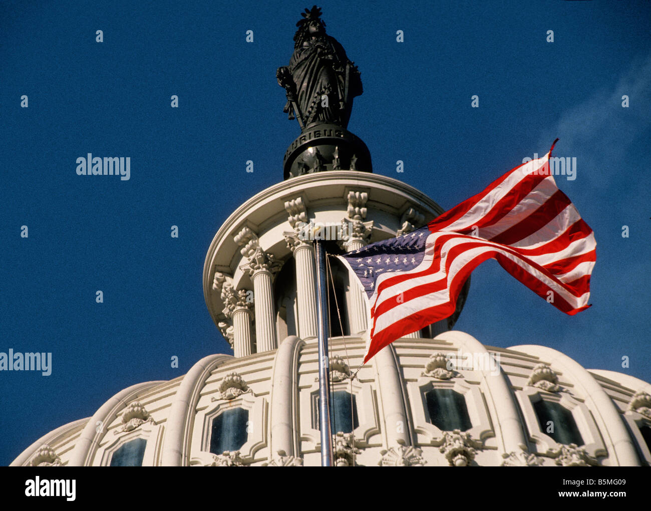 Capitol Building Washington DC. The Statue of Freedom, American Flag and Capitol Dome are an integral part of the government building. USA Stock Photo
