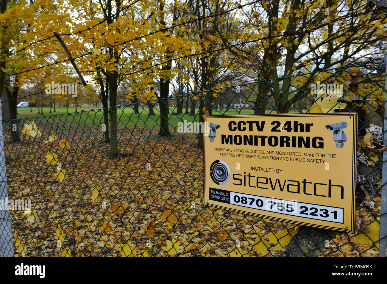 Security sign on the fence at the site of a potential new eco town 'Middle Quinton' near Long Marston Warwickshire Stock Photo