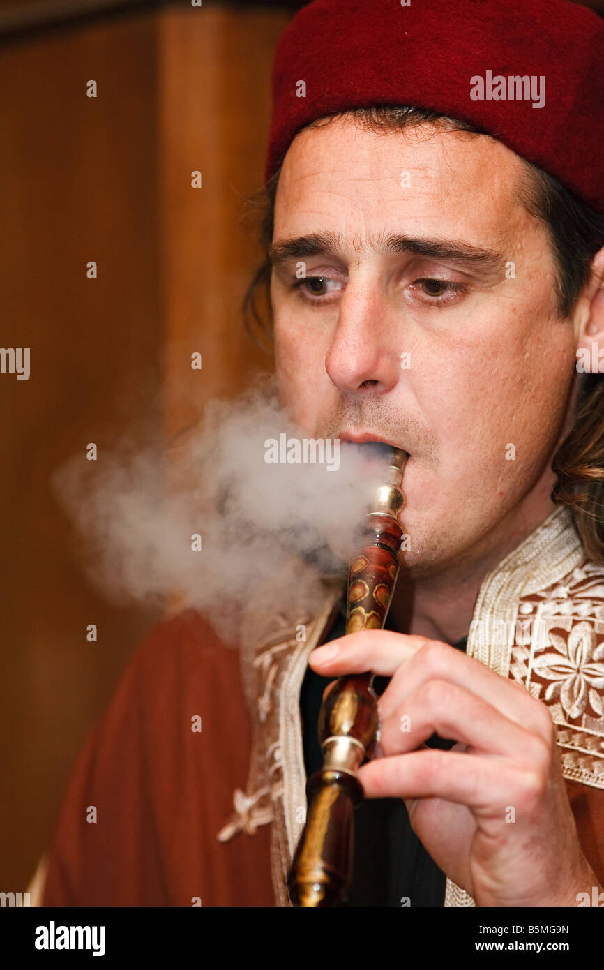 man smoking traditional water pipe hookah Stock Photo Alamy
