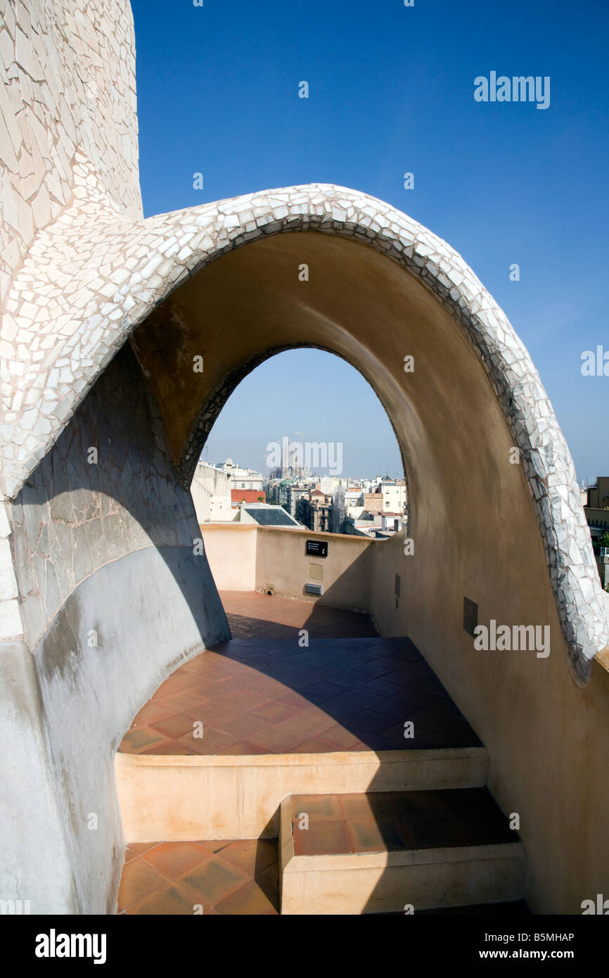 Chimneys Casa Milà La Pedrera 1906 1910 by architect Antoni Gaudí Passeig de Gràcia Barcelona Spain, looking at sagrada familia Stock Photo