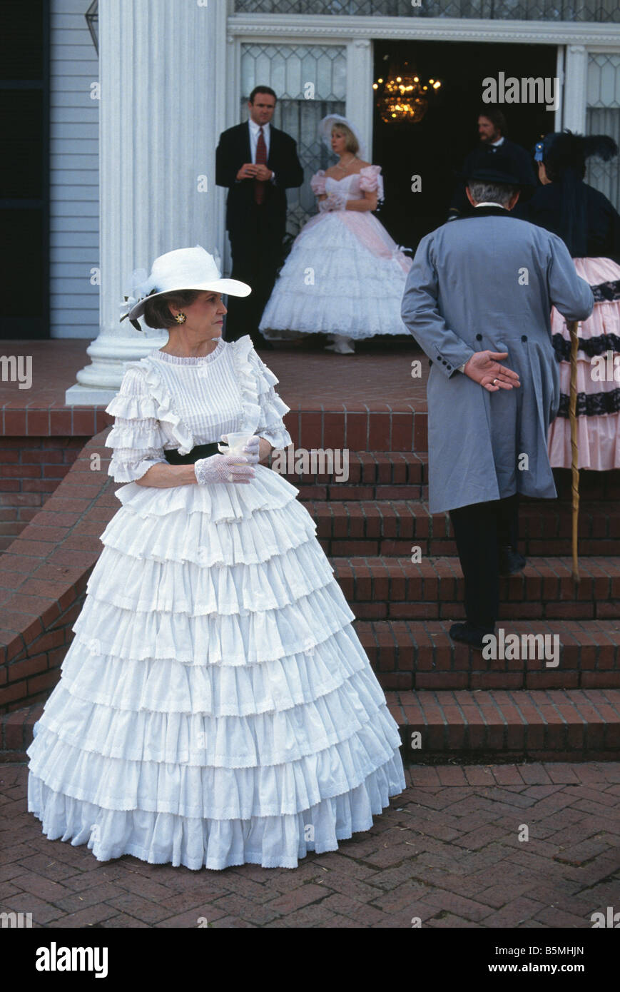 Woman in a hoop skirt outside Oak Square Plantation during the Heritage Festival in Port Gibson Mississippi USA Stock Photo