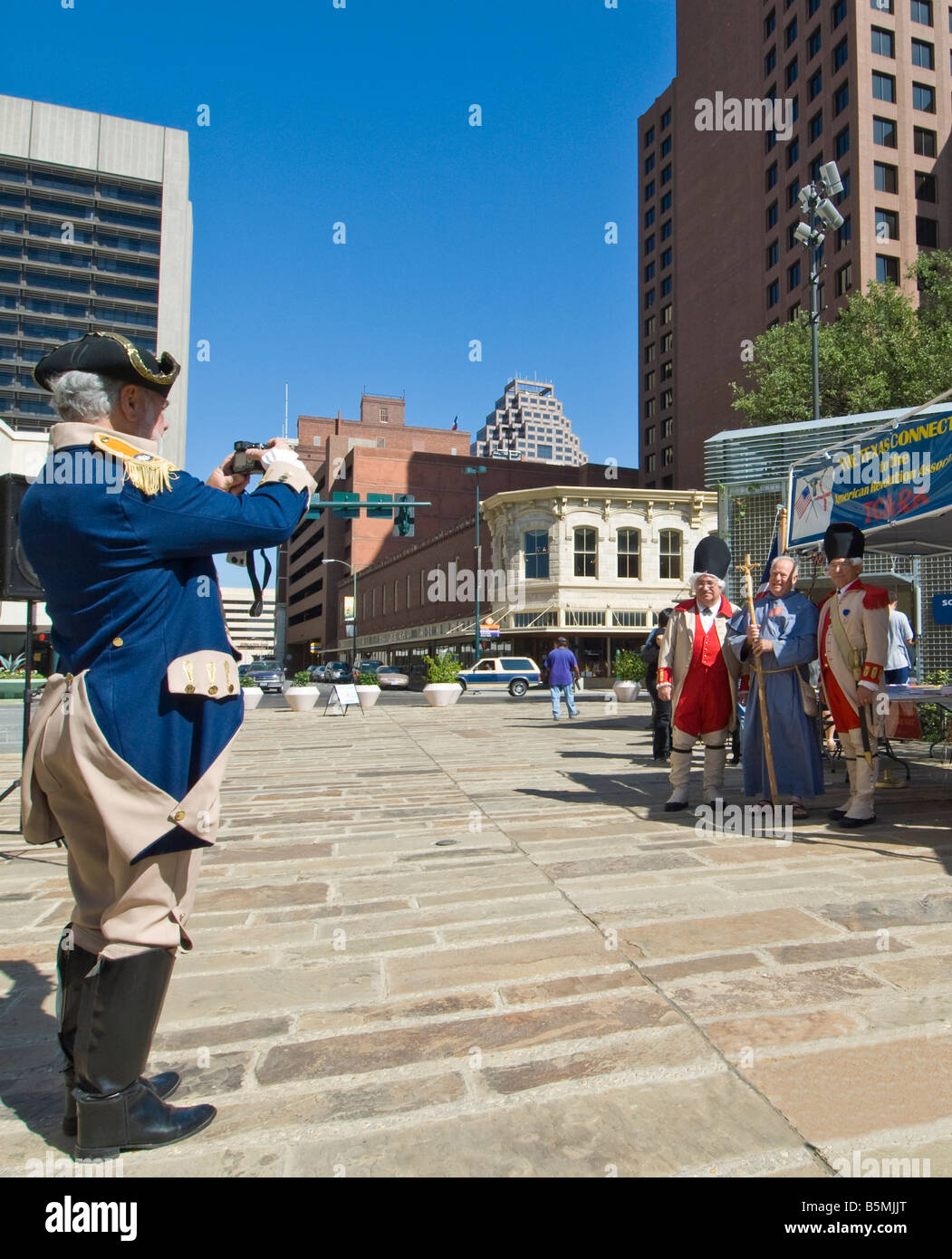 Man in costume photographs folks in costume, Founders Day celebration