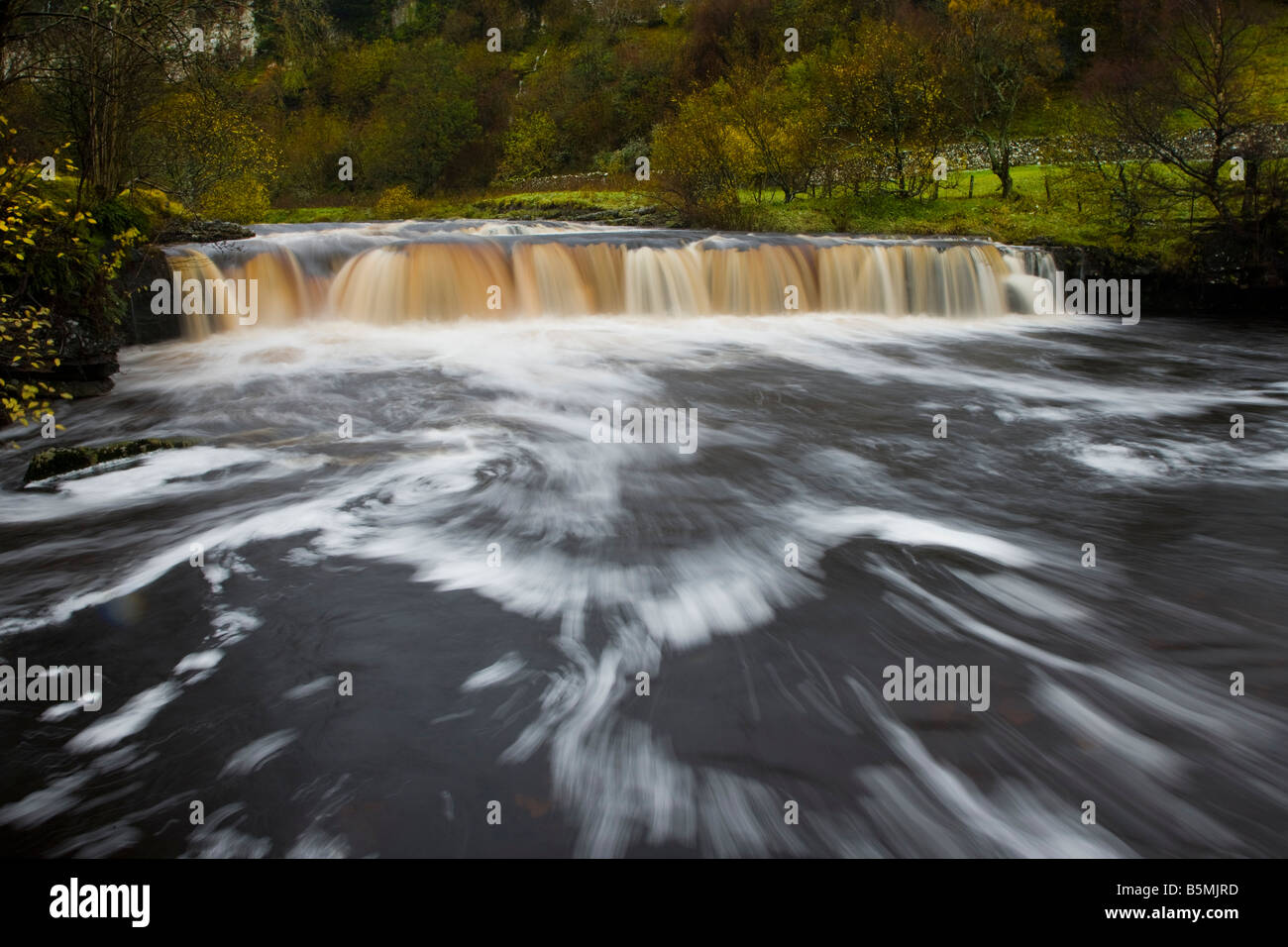 Wain Wath Force in November after heavy rain Upper Swaledale Yorkshire Dales National Park Stock Photo