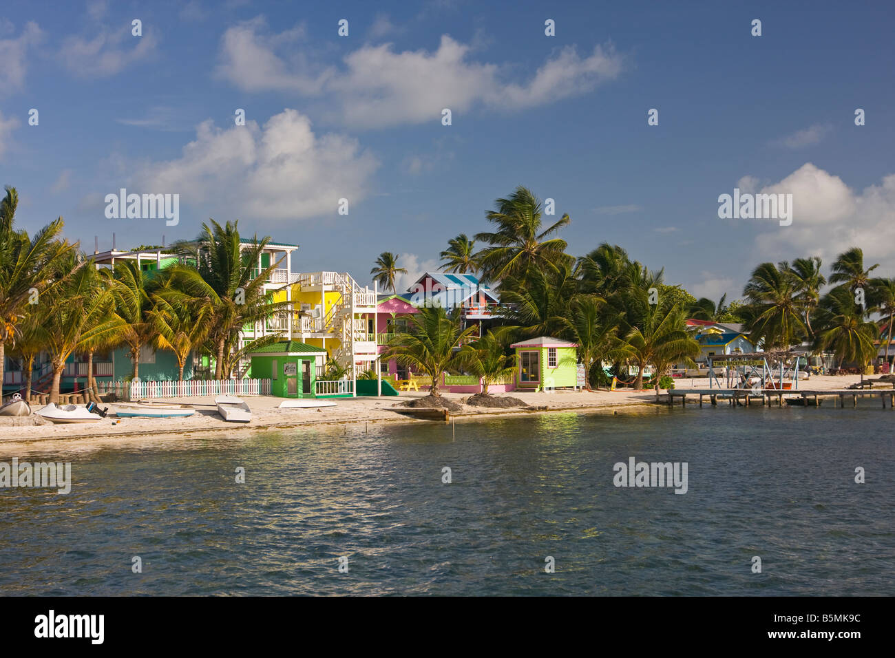 CAYE CAULKER BELIZE Hotels and palm trees on beach Stock Photo