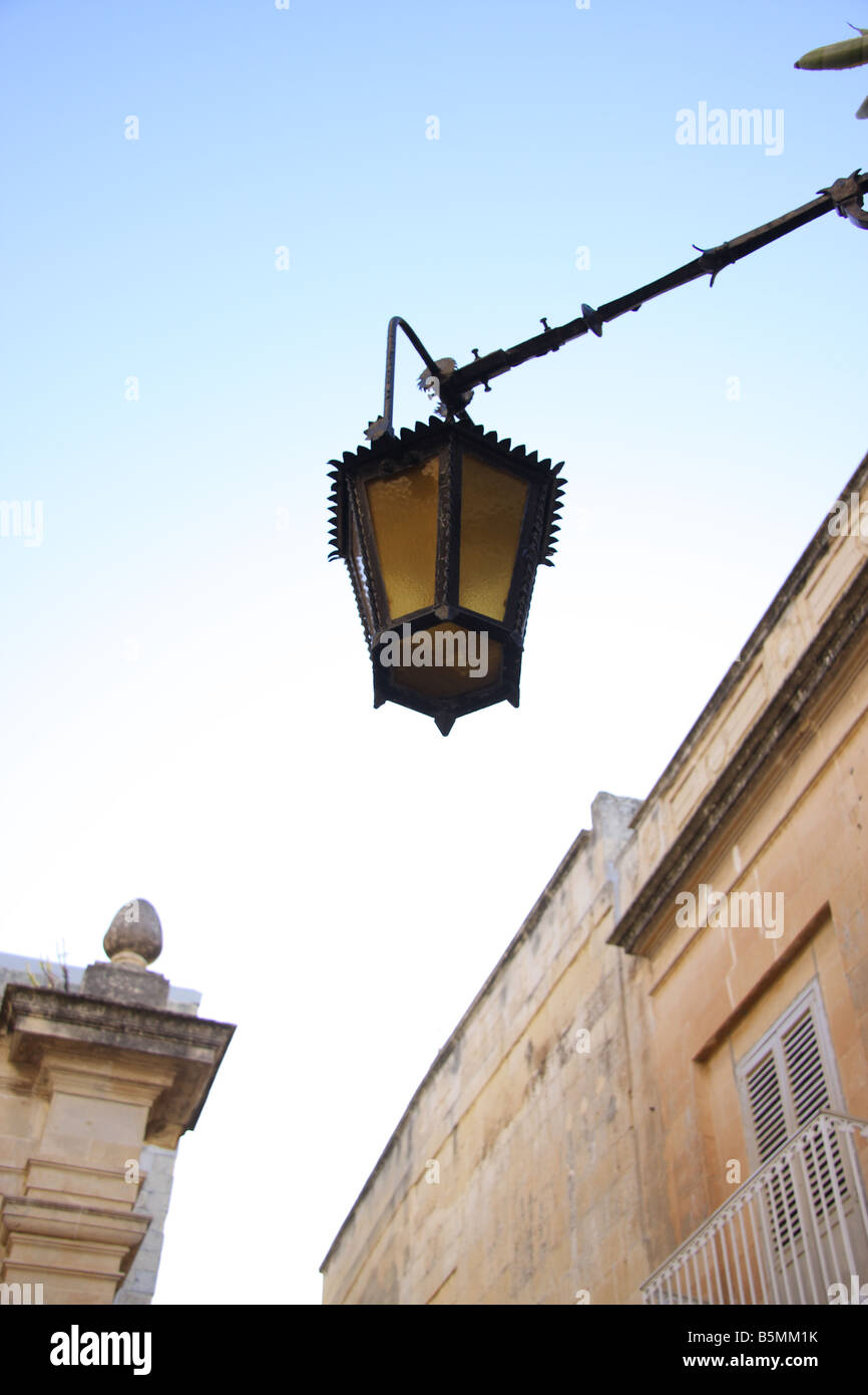 Old lamp in street corner of mdina old capital city of malta stock