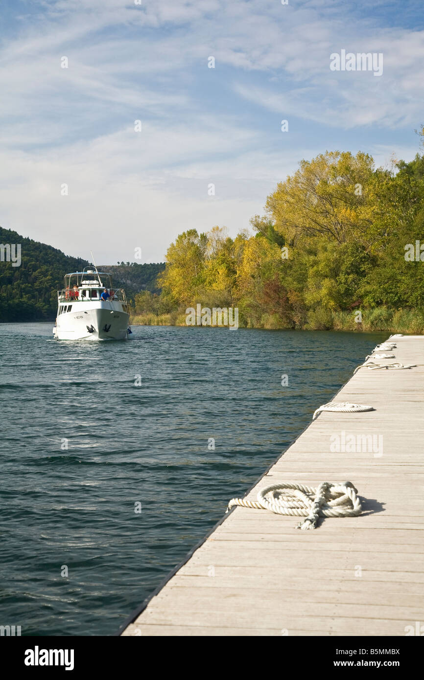 Small passenger ferry boat on the River Krka in autumn sunshine Krka National Park Dalmatia Croatia Europe Stock Photo