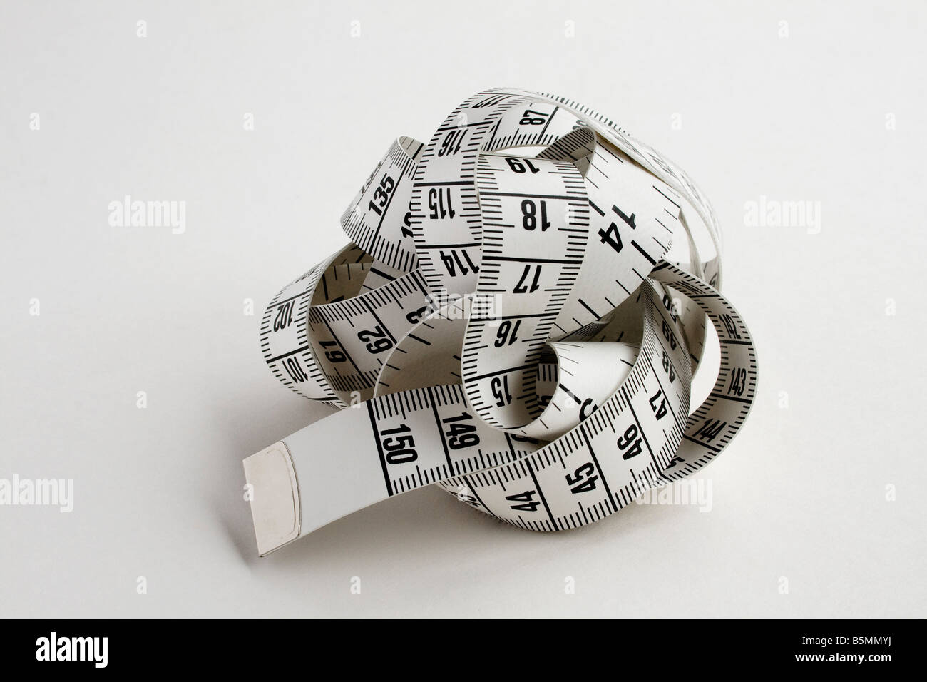 A tape measure, twisted into a ball Stock Photo Alamy