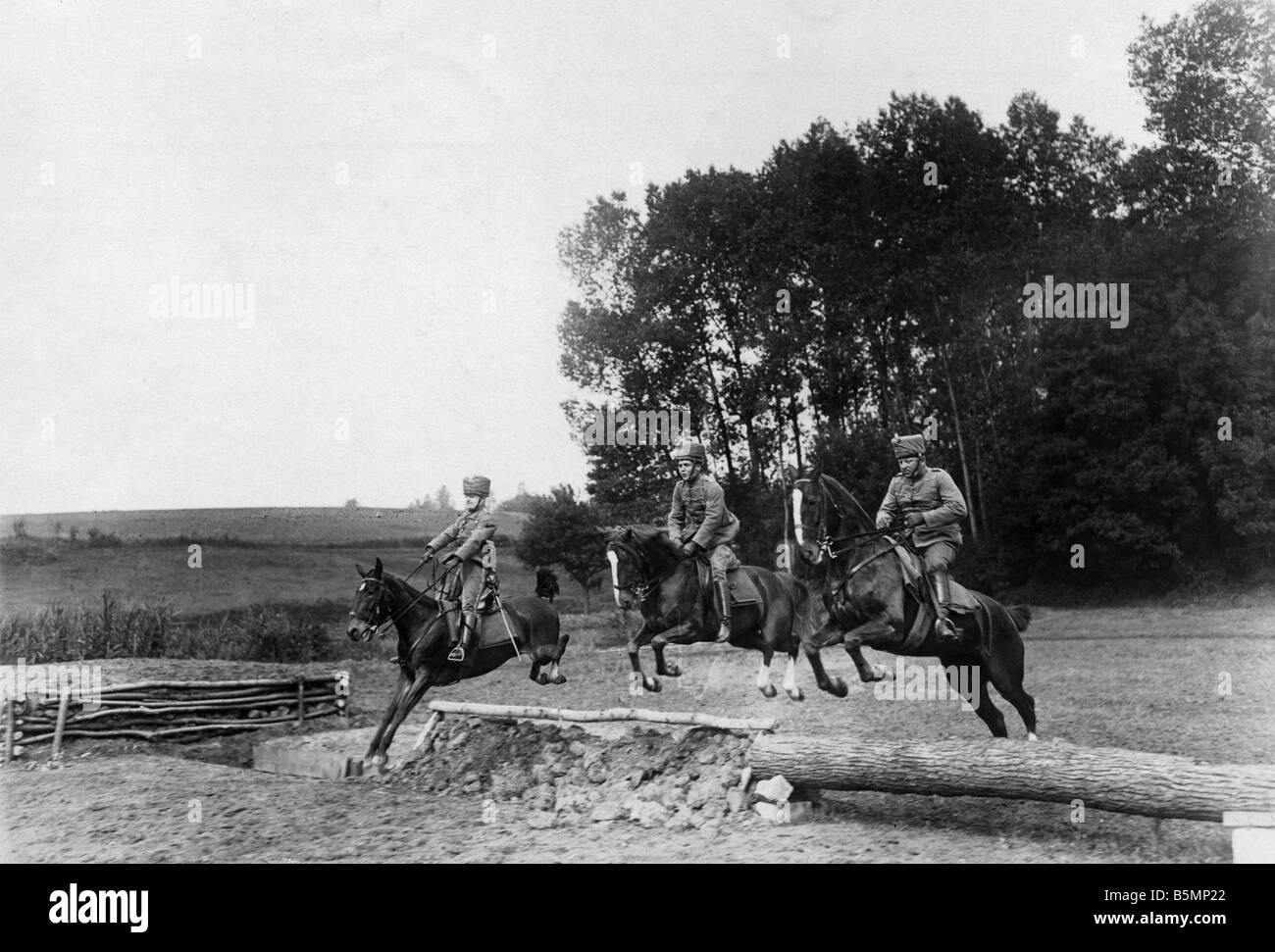 WW I German Hussars jumping barriers World War I Western Front officers jumping a fence Photo Otto Haeckel Stock Photo