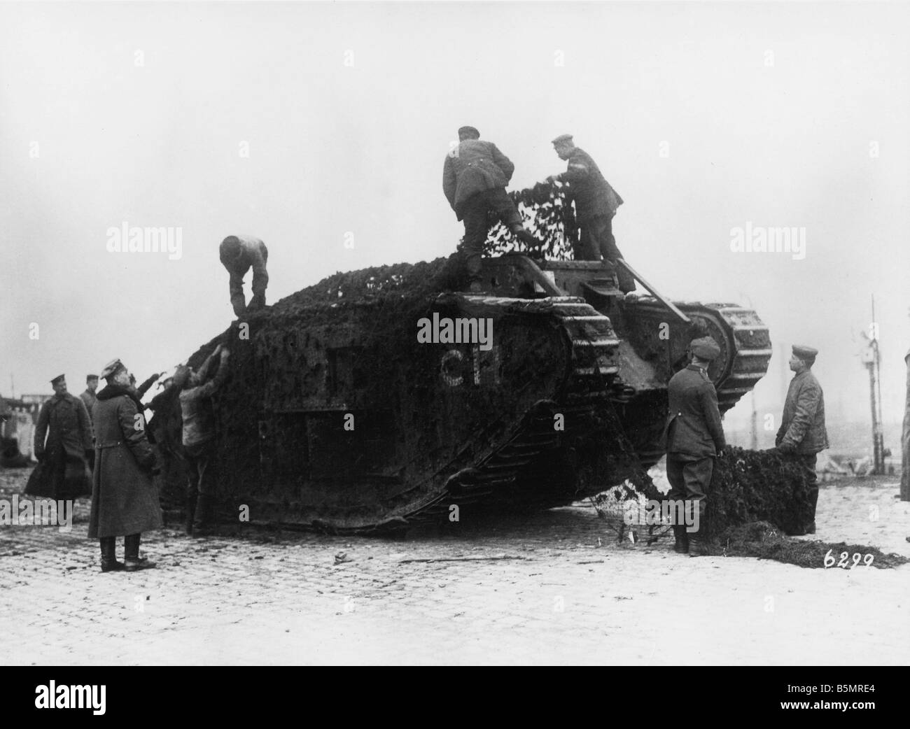 Premium Photo  Modern battle tank in a camouflage masking net isolated on  a white background