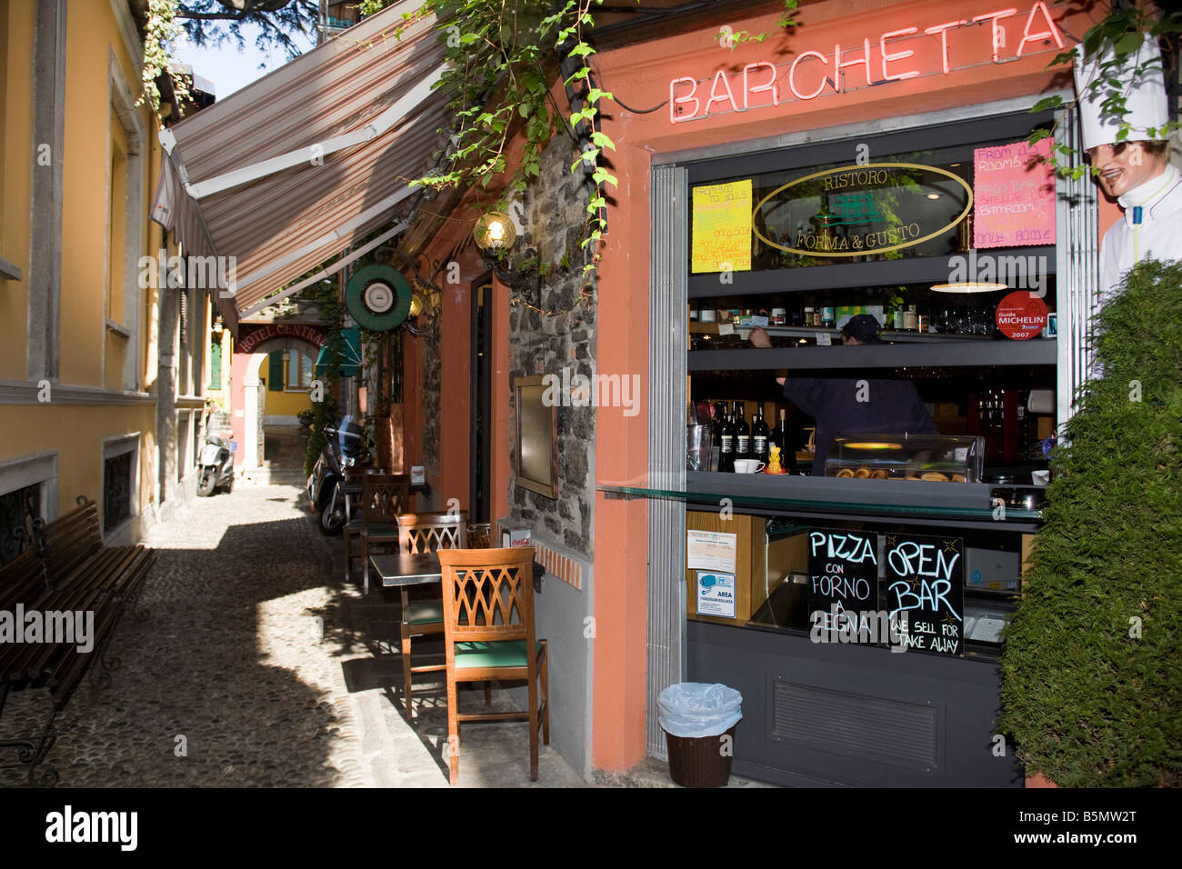 Bellagio, Lake Com, narrow streets with wine bars and restaurant. Como, Italy Stock Photo