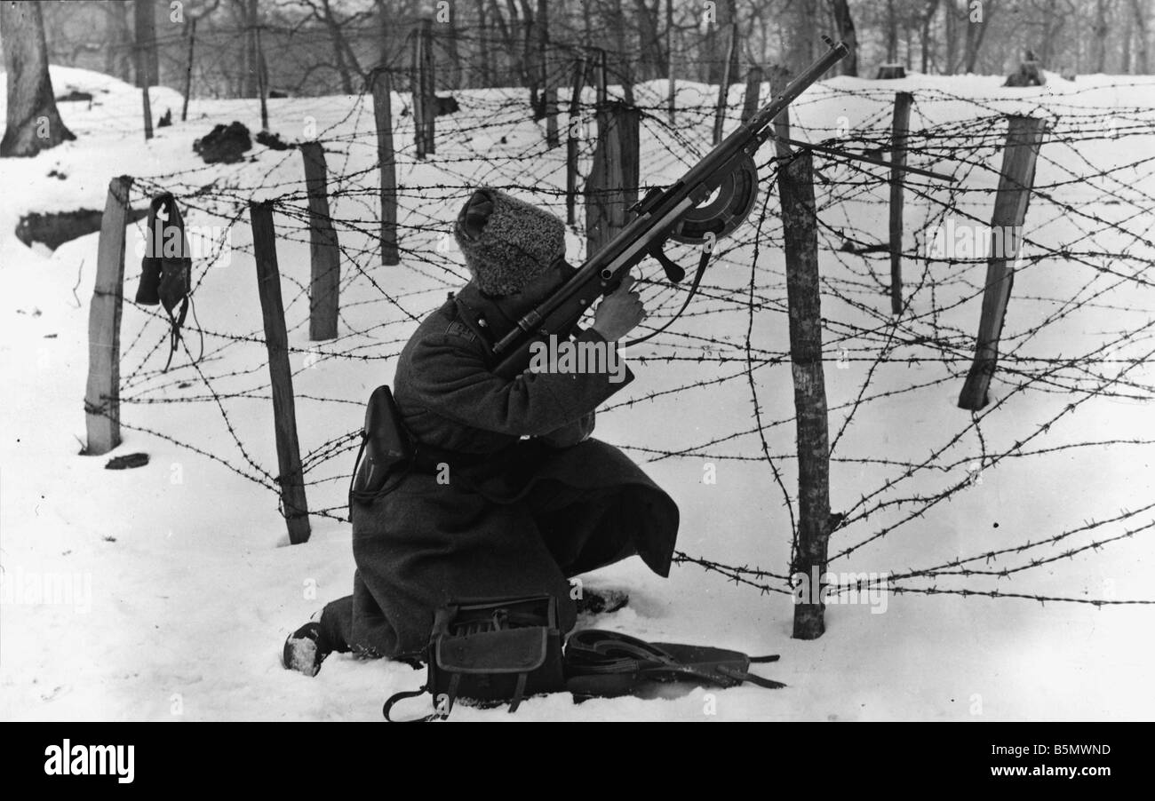 WW1 Russian riflemen firing 1917 Russia World War 1 Russian riflement firing behind a barbed wire fence Photo 21 2 1917 Stock Photo